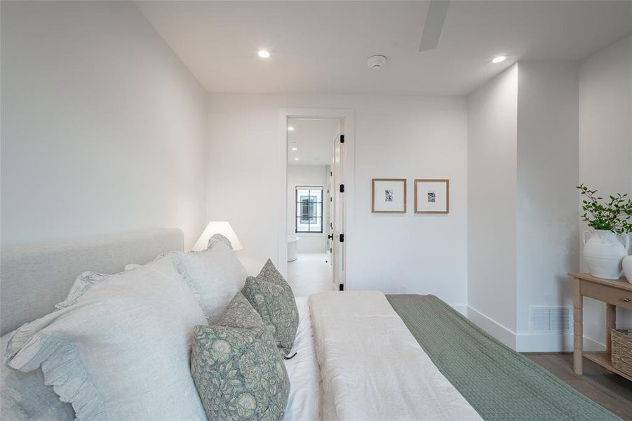 Bedroom with hardwood / wood-style floors