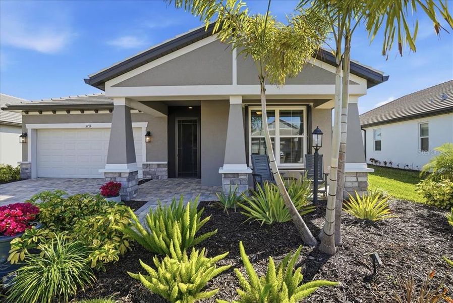 Exterior details and patio area of a home in Cypress Glen at River Wilderness, Parrish (Image 4).