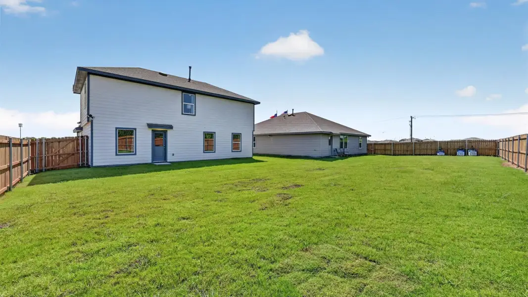 Exterior details and patio area of a home in Ponder Farms, Ponder (Image 20).
