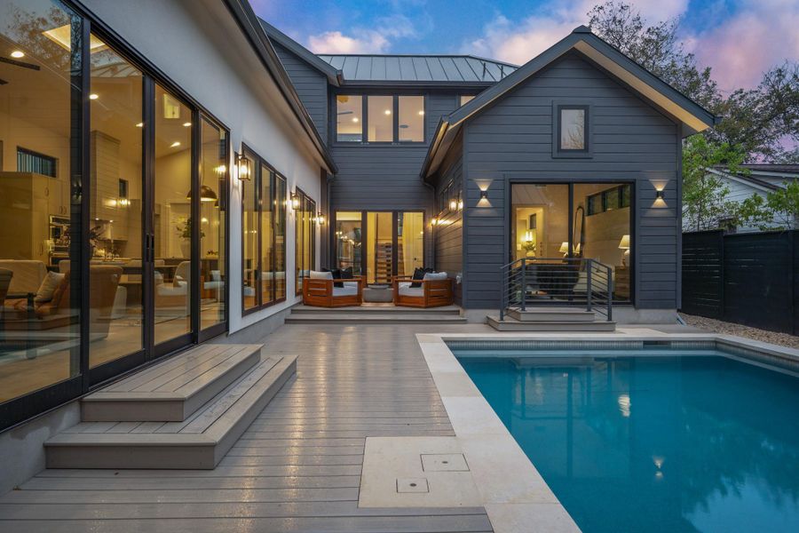 Outdoor pool featuring a deck and an outdoor hangout area