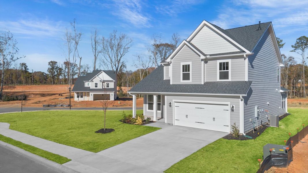 Exclusive DRB Homes exterior with balanced proportions and vibrant curb appeal