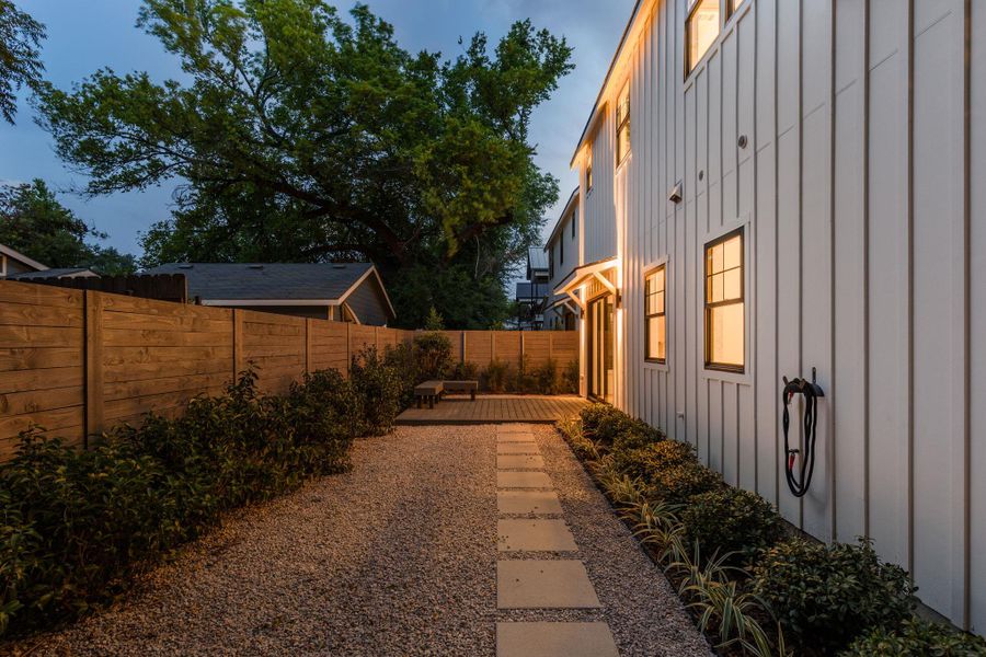 Fenced backyard with a wooden deck Fenced backyard with a wooden deck