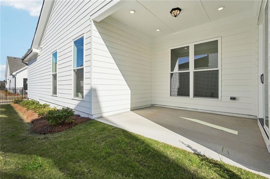 Exterior details and patio area of a home in Promenade at Sawnee Village, Cumming (Image 33).