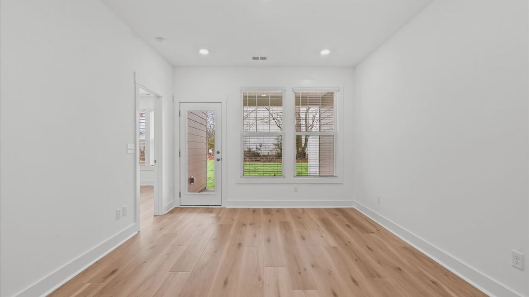 First-rate family room with thoughtful layout and superior connection to kitchen and dining spaces located in Greenville, SC
