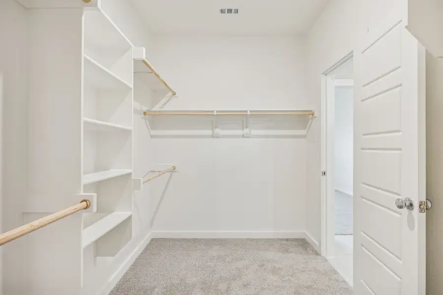 Primary Closet in the Stanley II home plan by Trophy Signature Homes – REPRESENTATIVE PHOTO Primary Closet in the Stanley II home plan by Trophy Signature Homes – REPRESENTATIVE PHOTO