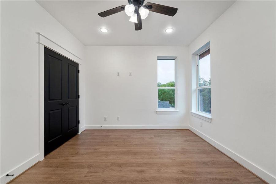 Bedroom number two: Notice these sleek black doors and one of a kind door frames, giving the home a truly custom finish.