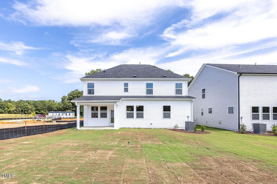 Front exterior of a new home in Woodland Crossing, Zebulon, NC, highlighting curb appeal (Image 2).
