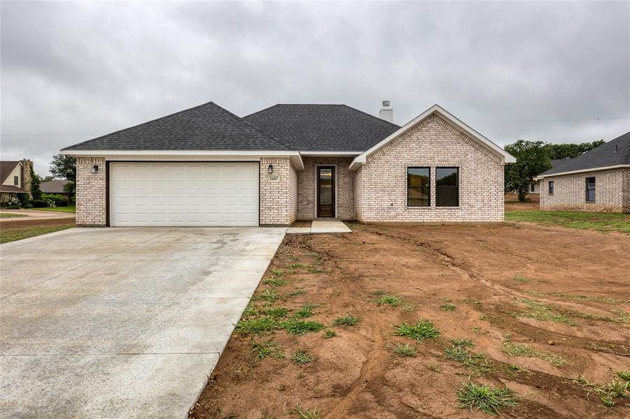 Front exterior of a new home in , Jacksboro, TX, highlighting curb appeal (Image 1). Front exterior of a new home in , Jacksboro, TX, highlighting curb appeal (Image 1).