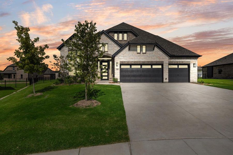 Front exterior of a new home in Heath Golf and Yacht, Heath, TX, highlighting curb appeal (Image 18). Front exterior of a new home in Heath Golf and Yacht, Heath, TX, highlighting curb appeal (Image 18).