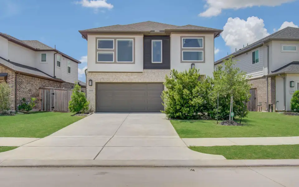 Front exterior of a new home in , Cypress, TX, highlighting curb appeal (Image 1). Front exterior of a new home in , Cypress, TX, highlighting curb appeal (Image 1).