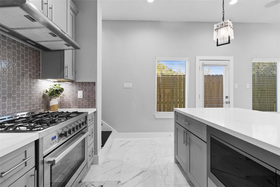 From this angle, your kitchen feels bright, open, and ready for real life—marble-style floors, generous prep space, and a large island that anchors the room for cooking, gathering, or casual mornings at home. Natural light pours in, keeping everything airy and connected to the outdoors. From this angle, your kitchen feels bright, open, and ready for real life—marble-style floors, generous prep space, and a large island that anchors the room for cooking, gathering, or casual mornings at home. Natural light pours in, keeping everything airy and connected to the outdoors.