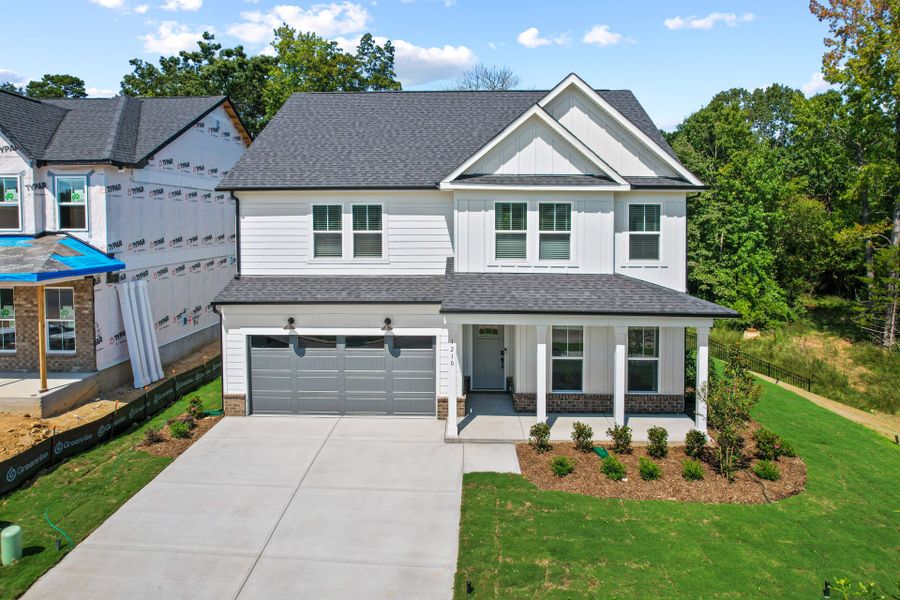Front exterior of a new home in Elmbrook, Indian Trail, NC, highlighting curb appeal (Image 29). Front exterior of a new home in Elmbrook, Indian Trail, NC, highlighting curb appeal (Image 29).