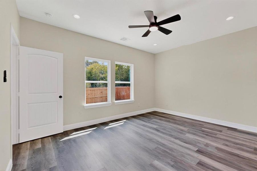 Unfurnished room featuring wood finished floors, recessed lighting, and a ceiling fan Unfurnished room featuring wood finished floors, recessed lighting, and a ceiling fan