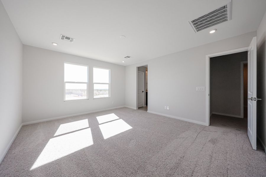 A room with a white floor and a window.