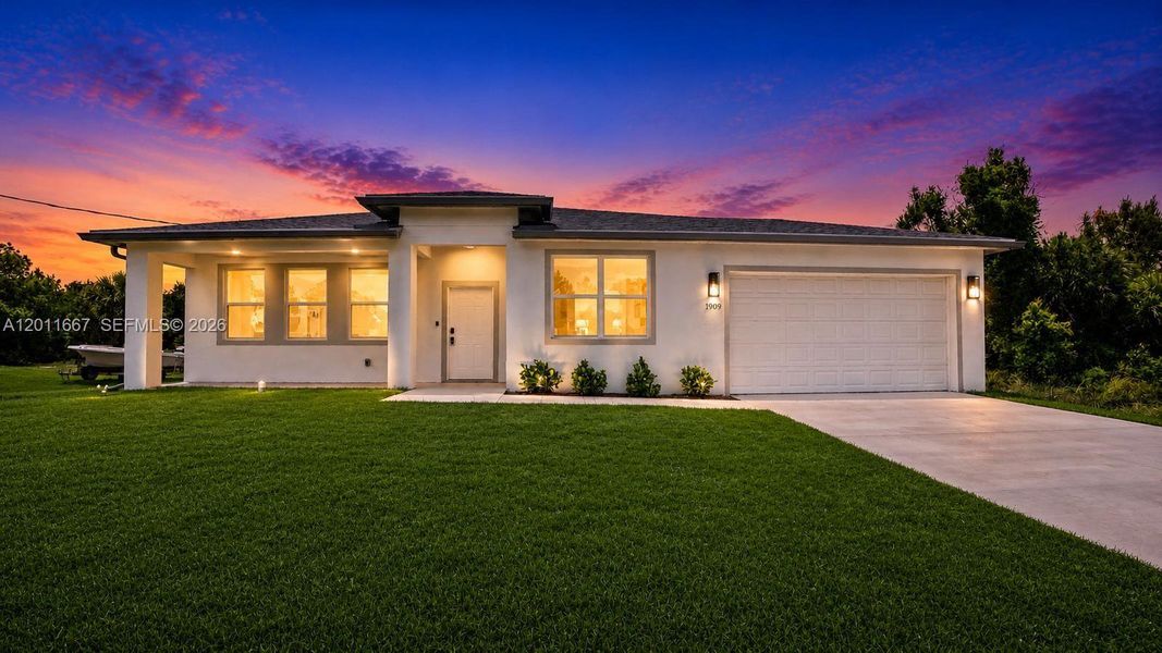 Front exterior of a new home in , Lehigh Acres, FL, highlighting curb appeal (Image 18). Front exterior of a new home in , Lehigh Acres, FL, highlighting curb appeal (Image 18).