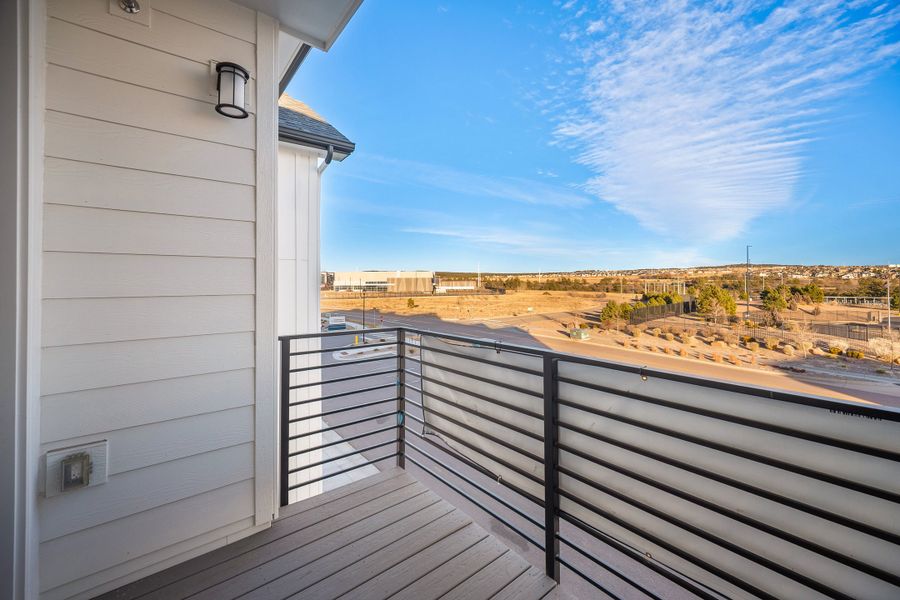 Exterior details and patio area of a home in The Residences at Victory Ridge, Colorado Springs (Image 18).