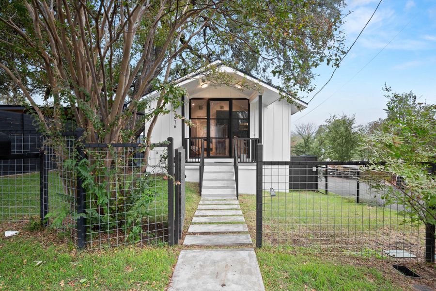 Bungalow-style house featuring a gate and a fenced front yard