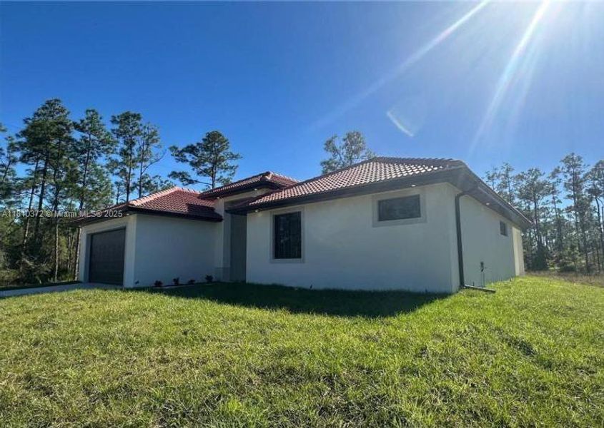 Exterior details and patio area of a home in , Lehigh Acres (Image 3). Exterior details and patio area of a home in , Lehigh Acres (Image 3).