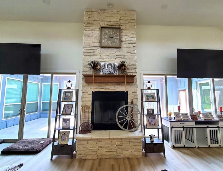 Indoor Fireplace with 2 Double Door Entries to the Outside Atrium/Living Area