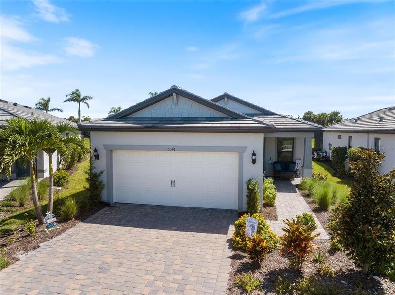 Front exterior of a new home in , Nokomis, FL, highlighting curb appeal (Image 24).