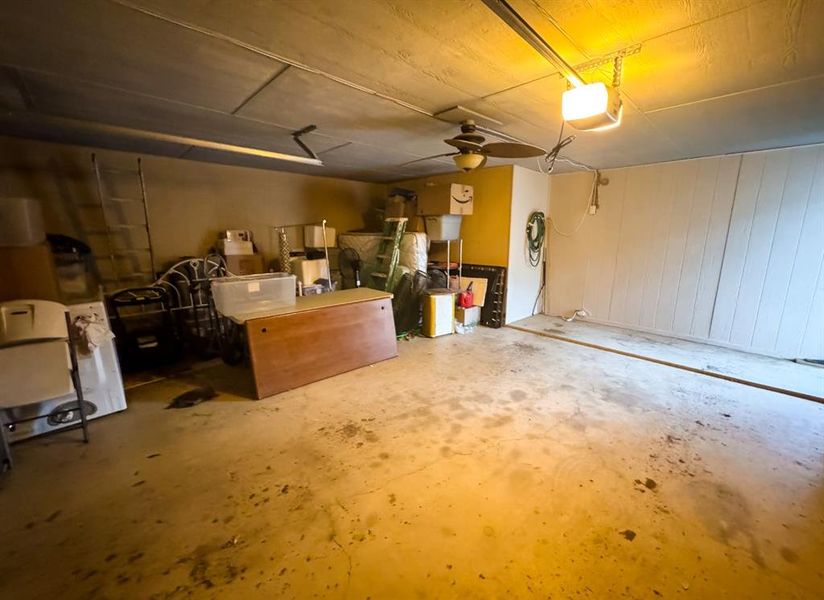 Garage featuring a garage door opener