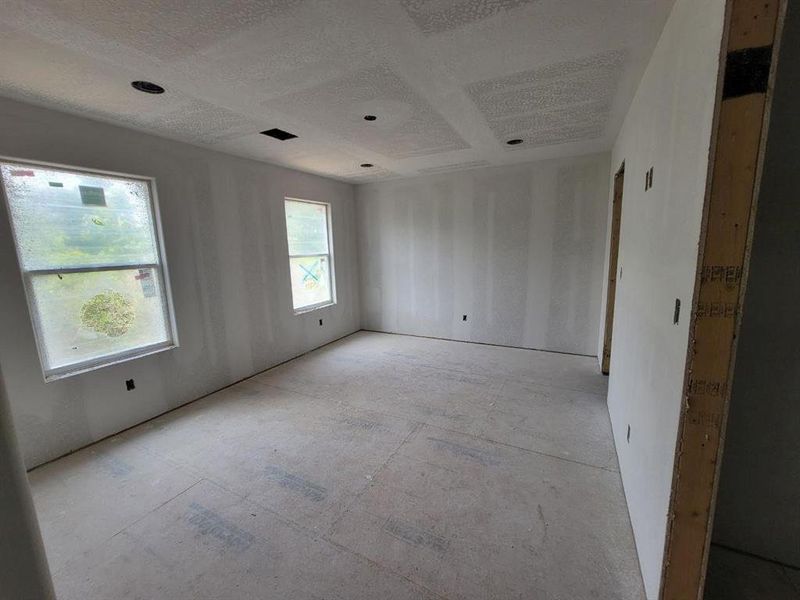 This is the large primary bedroom with en-suite bath to the right.