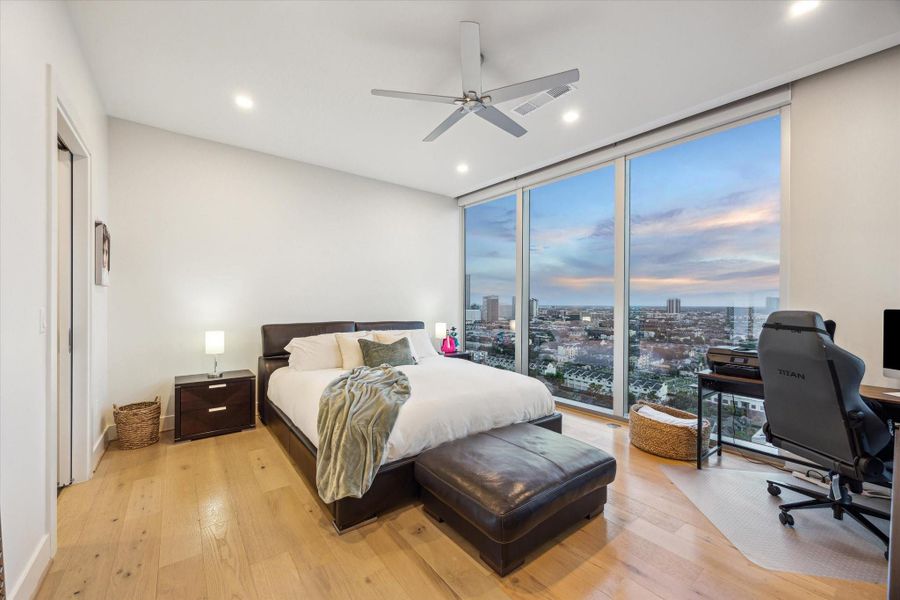 The luxurious primary suite provides a serene sanctuary.  It is complimented by electric backout and solar shades.