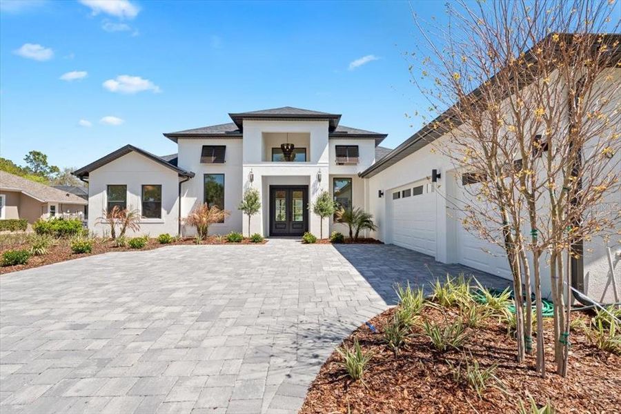 Front exterior of a new home in , Palm Coast, FL, highlighting curb appeal (Image 28). Front exterior of a new home in , Palm Coast, FL, highlighting curb appeal (Image 28).
