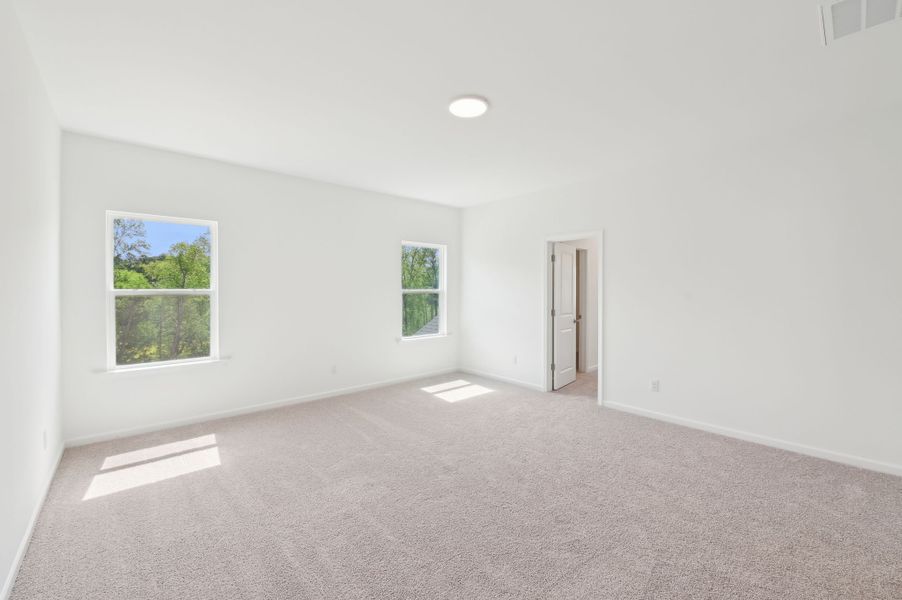 Representative unfurnished interior of a home built from the Alexis by Ashton Woods in Rowland's Grant, Fuquay Varina (Image 37).