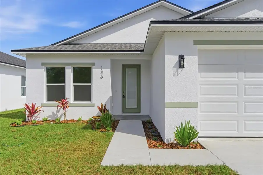 Exterior details and patio area of a home in , Osteen (Image 3).