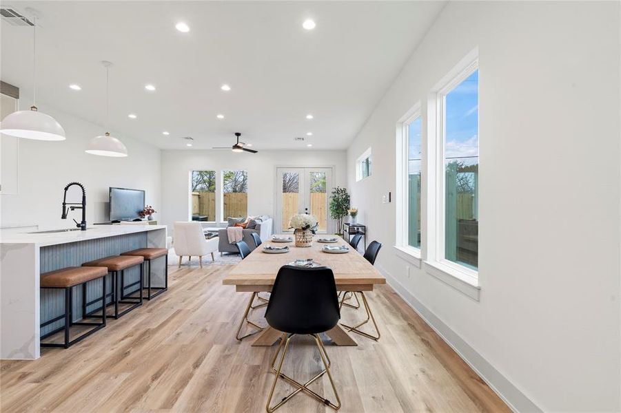 The space seamlessly connects to the dining area and kitchen, creating a perfect flow for entertaining