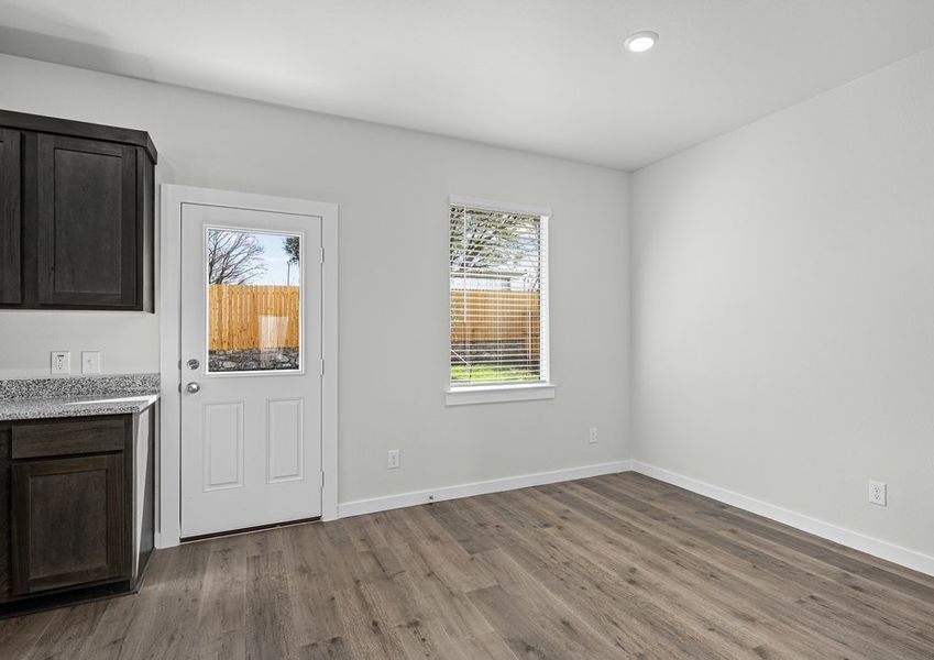 The dining room has a large window that lets in great, natural light.