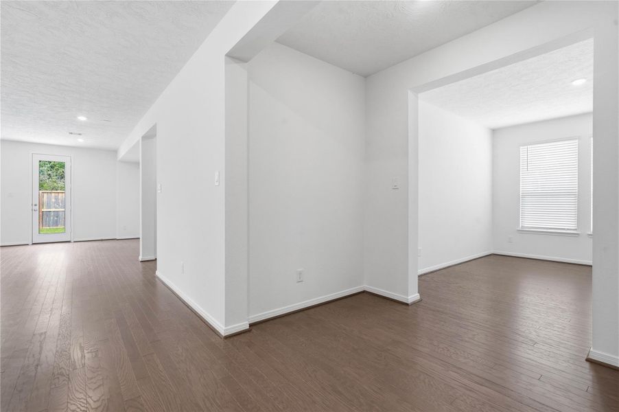 Across the home from the secondary bedrooms and bathroom is a hallway that leads to the Den and laundry room. Across the home from the secondary bedrooms and bathroom is a hallway that leads to the Den and laundry room.
