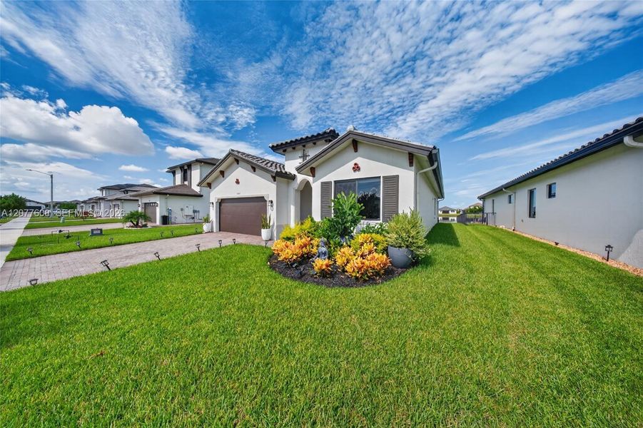 Front exterior of a new home in , Immokalee, FL, highlighting curb appeal (Image 31).