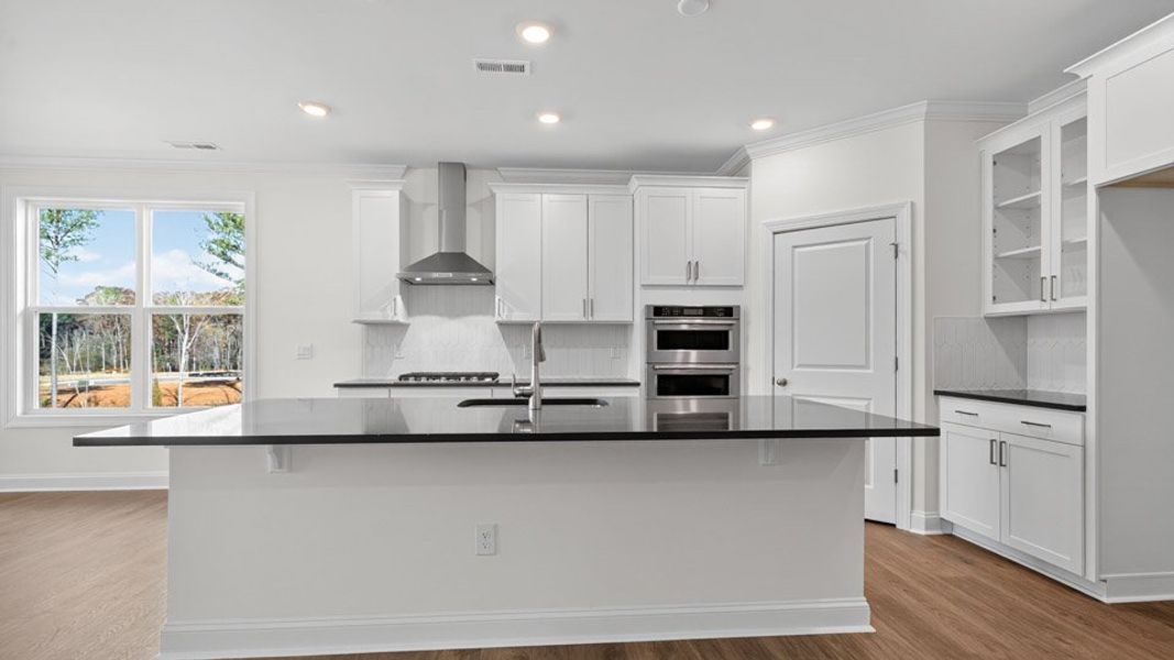 Furnished interior view inside a new home in The Estates Park, Apex (Image 4).