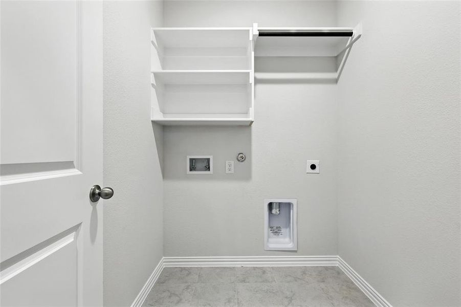 Laundry room with hookup for a washing machine, electric dryer hookup, and gas dryer hookup