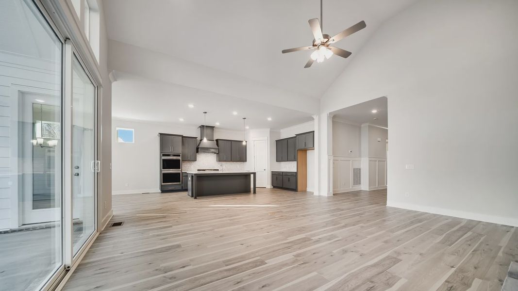 Open first floor layout with kitchen between living room and dining area