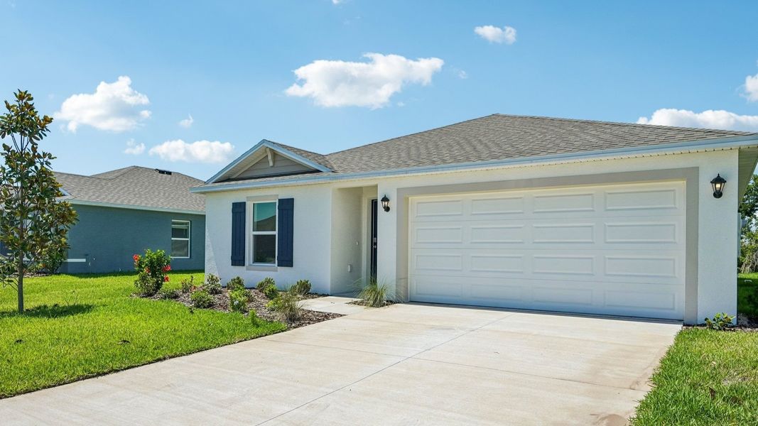 Front exterior of a new home in Rye Crossing, Parrish, FL, highlighting curb appeal (Image 2). Front exterior of a new home in Rye Crossing, Parrish, FL, highlighting curb appeal (Image 2).