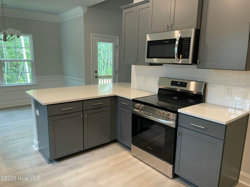 Furnished interior view inside a new home in Mill Creek Cove, Bolivia (Image 5).