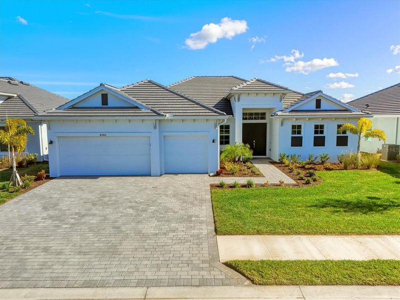 Front exterior of a new home in , Englewood, FL, highlighting curb appeal (Image 24).
