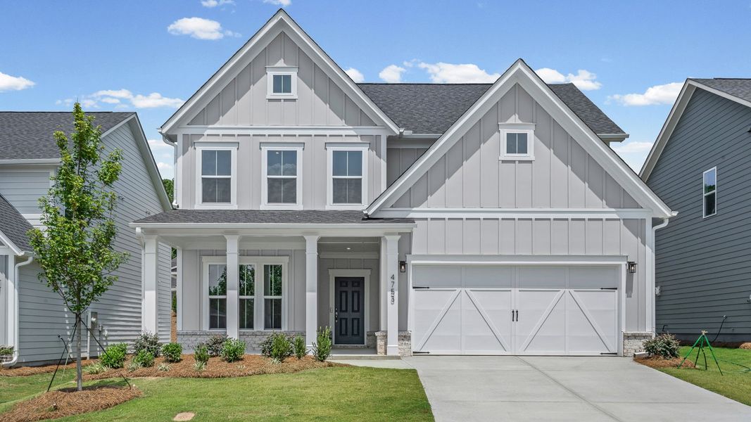 Front exterior of a new home in Hunters Creek, Flowery Branch, GA, highlighting curb appeal (Image 23). Front exterior of a new home in Hunters Creek, Flowery Branch, GA, highlighting curb appeal (Image 23).
