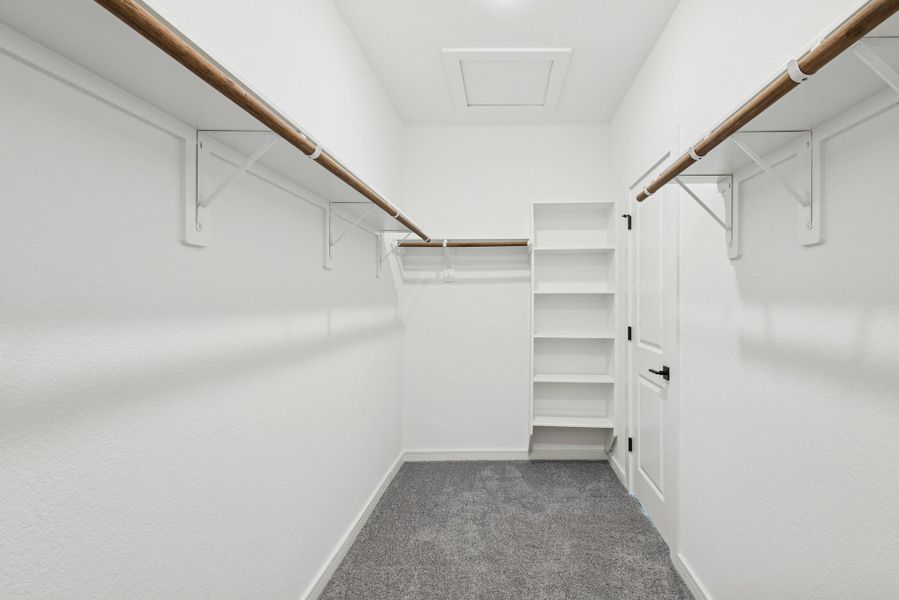 Primary walk-in closet (*Photo not of actual home and used for illustration purposes only.)