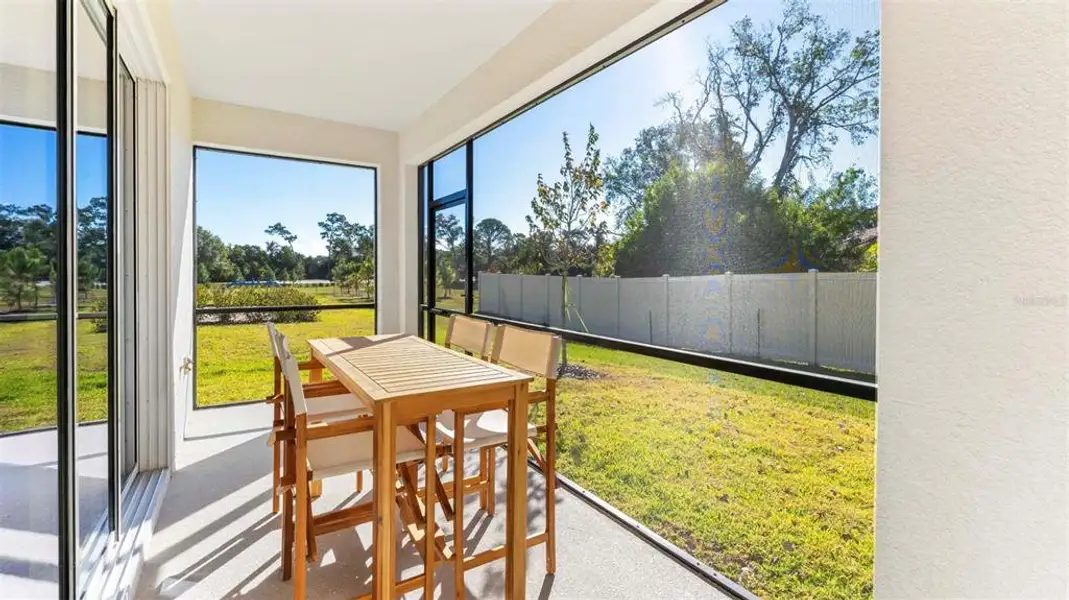 Exterior details and patio area of a home in Oasis at Longwood Run, Sarasota (Image 3).