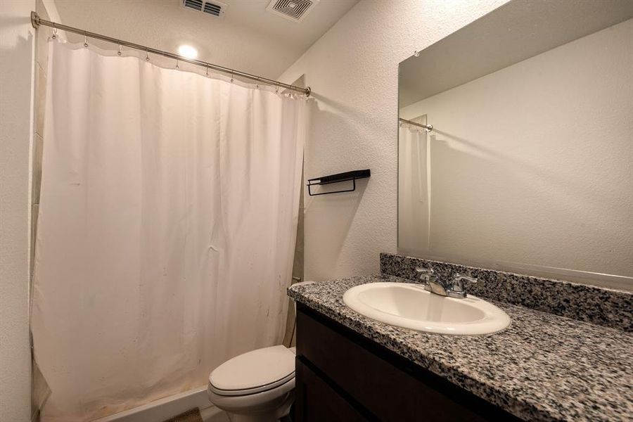 Bathroom with toilet and vanity