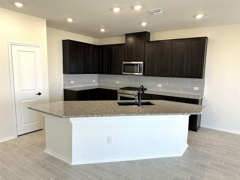 Furnished interior view inside a new home in Salerno - Classic Collection, Round Rock (Image 8). Furnished interior view inside a new home in Salerno - Classic Collection, Round Rock (Image 8).