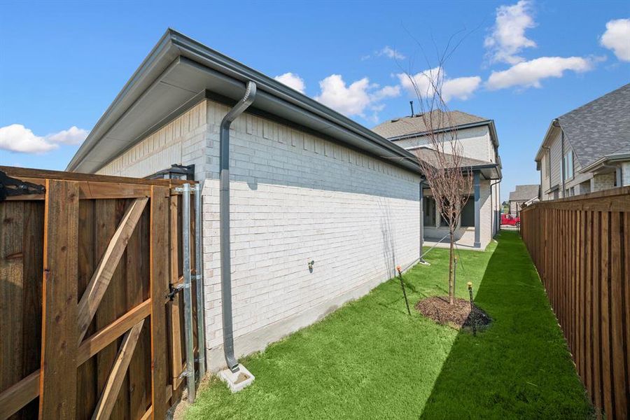 Exterior details and patio area of a home in Karis - Village Series, Crowley (Image 23). Exterior details and patio area of a home in Karis - Village Series, Crowley (Image 23).
