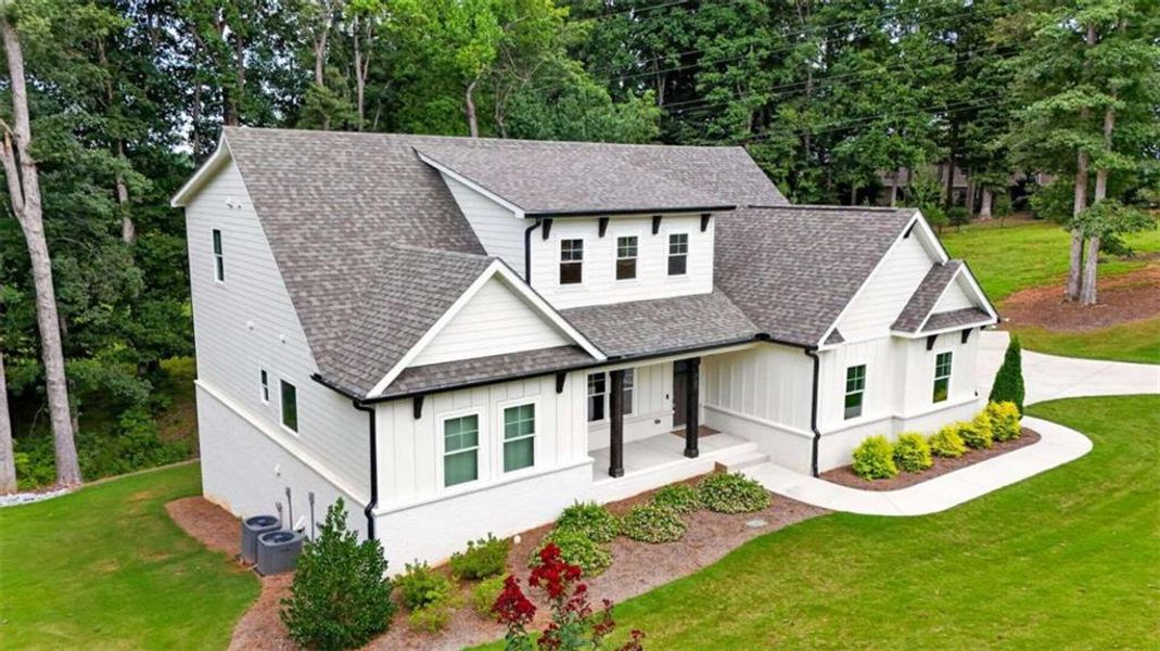 Front exterior of a new home in , Hoschton, GA, highlighting curb appeal (Image 32).