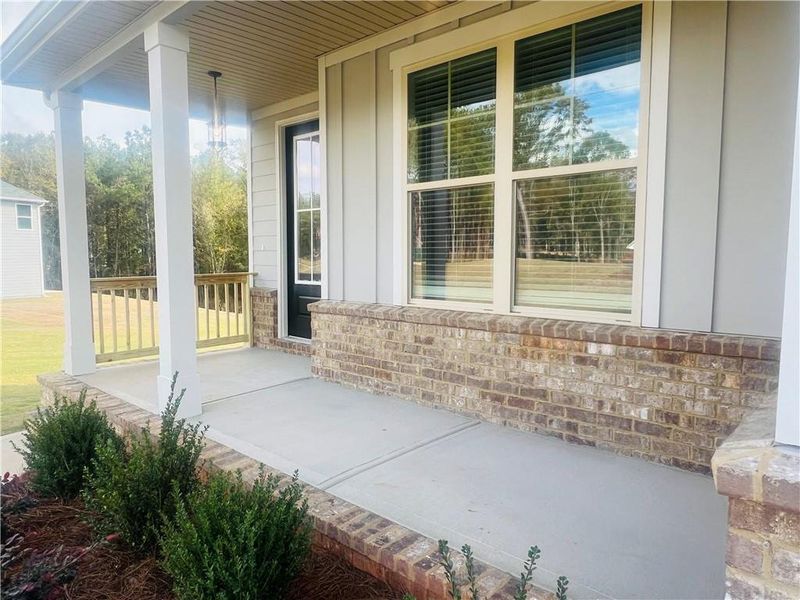 Exterior details and patio area of a home in Waters Edge, Mansfield (Image 10).