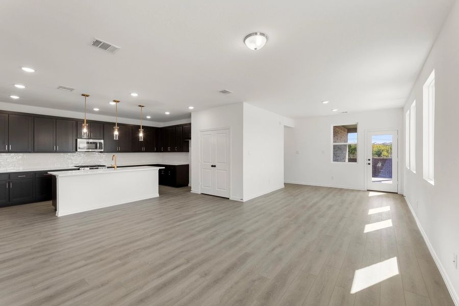 Open Kitchen-Living-Dining Room featuring the Oxford Collection