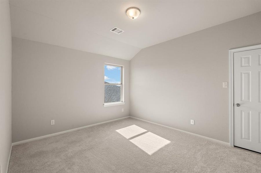 Your secondary bedroom features plush carpet, fresh paint, closet, and a large window that lets in plenty of natural lighting.